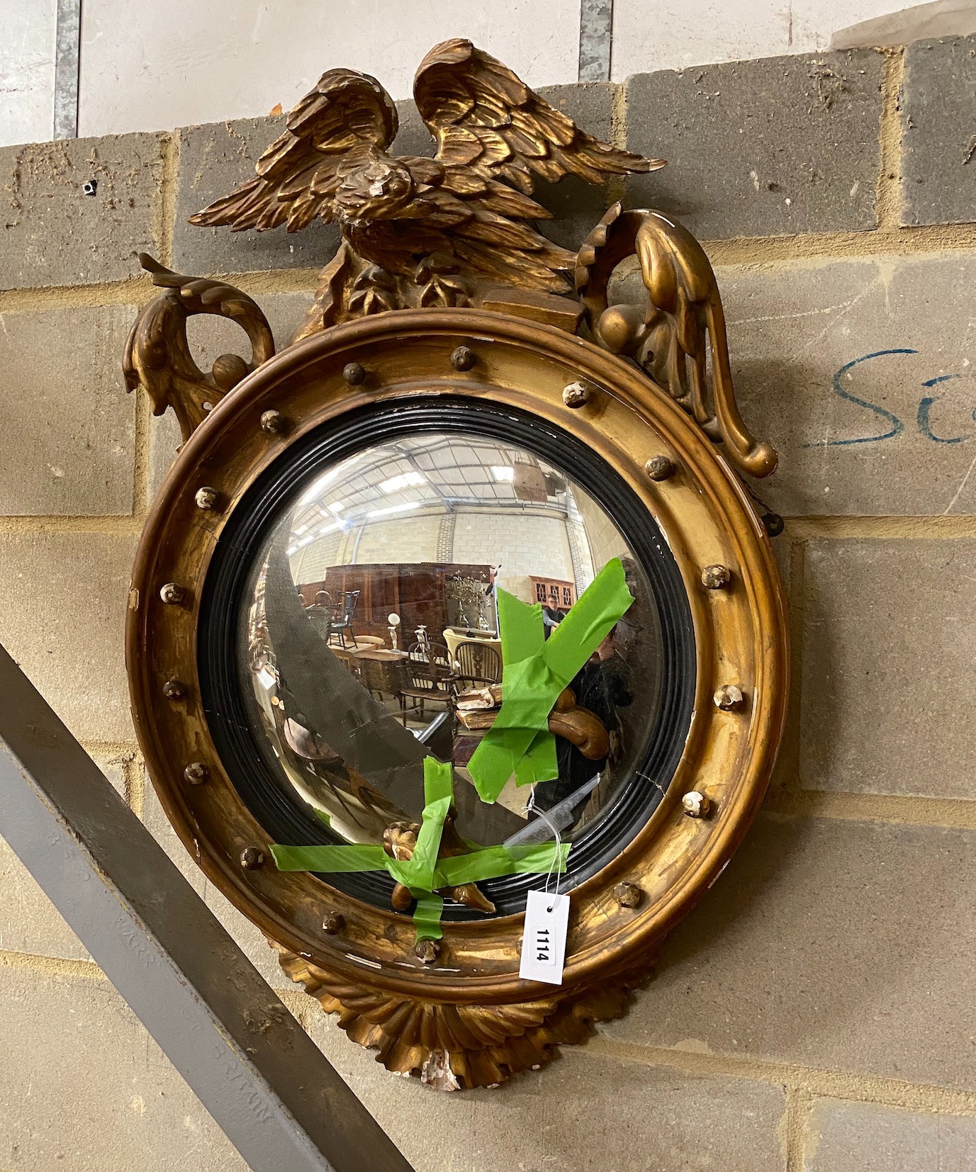 A Regency style convex eagle wall mirror, height 90cm, a.f.